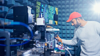Sumit Singh working in a high-frequency electronics lab on a radio receiver front-end operating at 300 GHz.